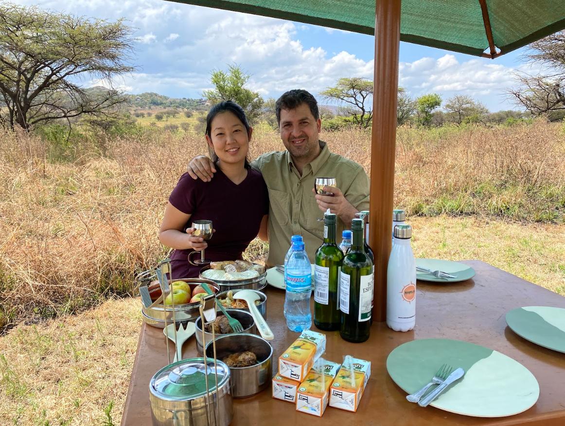 Tourist on safari enjoying a meal 