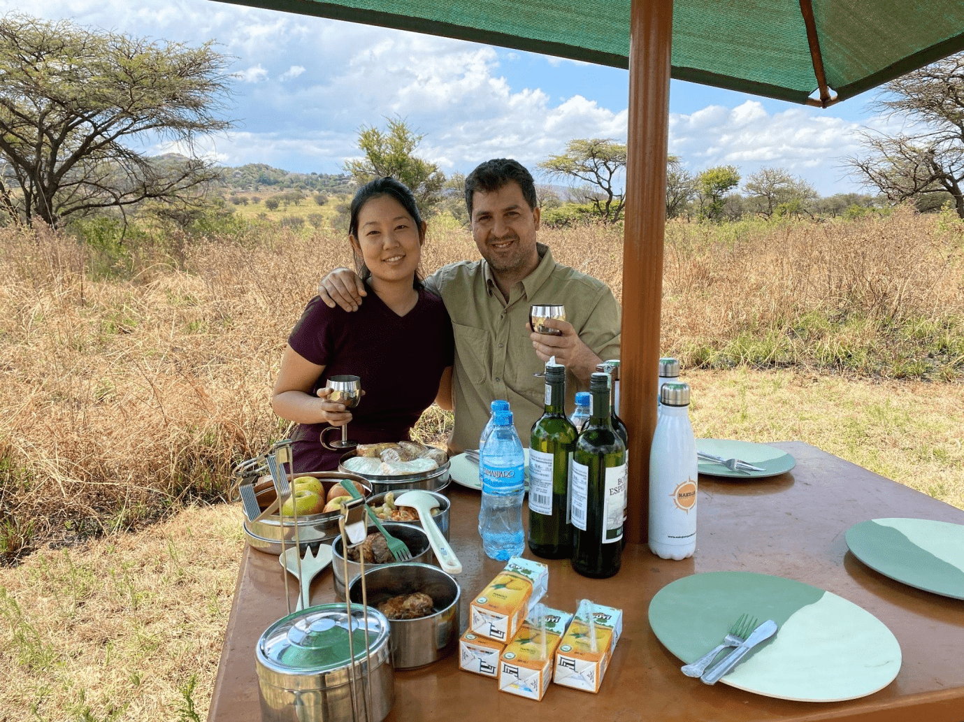 A couple enjoying a picnic in the jungle